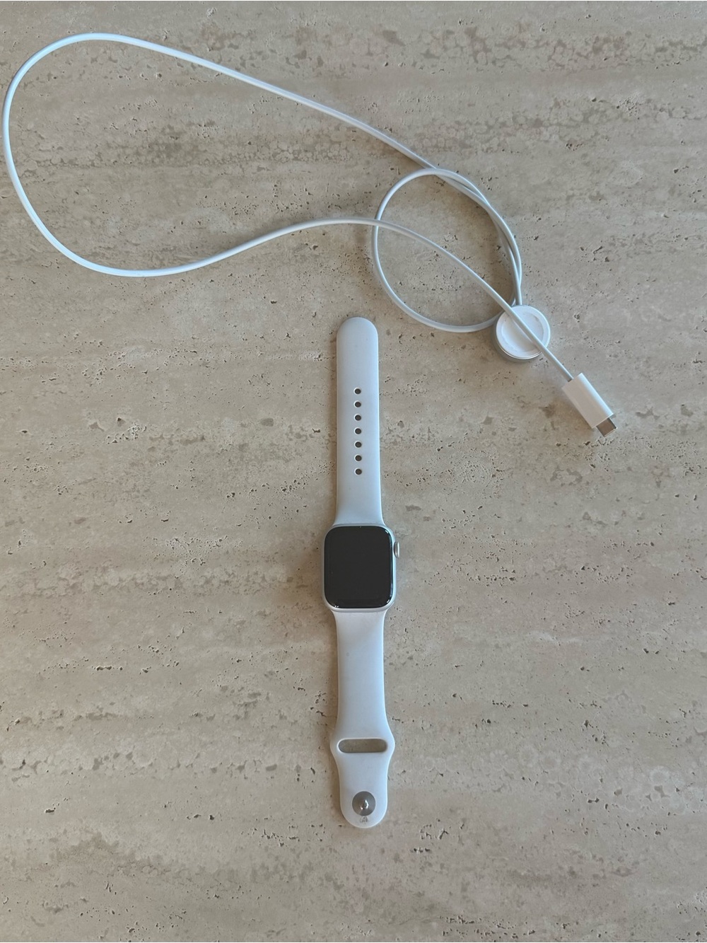 Apple Watch Series 8 with charging cord